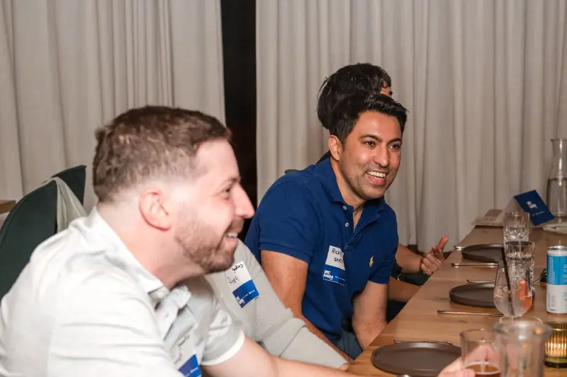 Two founders laughing at the table