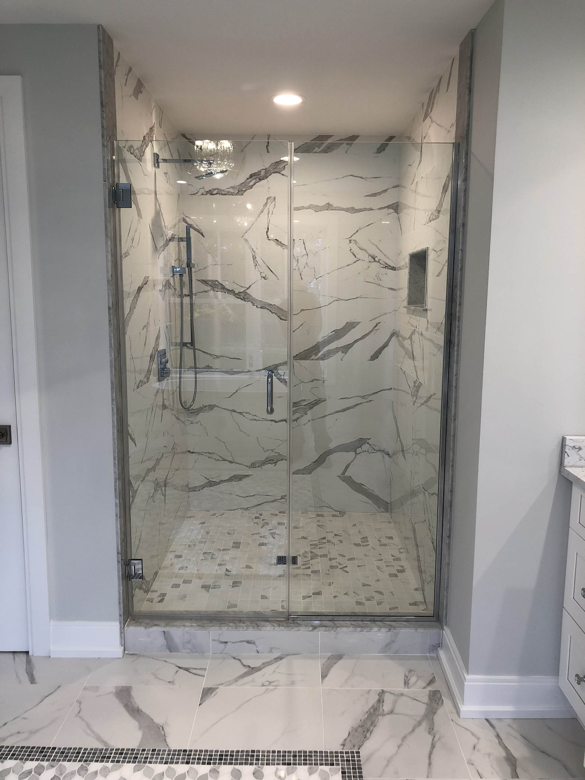 Shower tile detail with patterned niche and coordinated corners