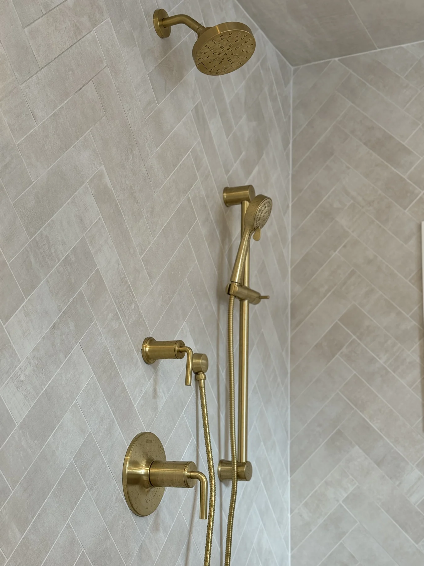 Herringbone shower wall tile