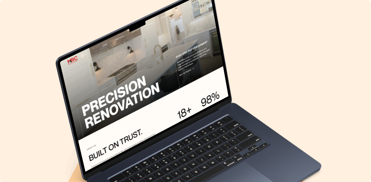 Open laptop displaying a website homepage with the headline Precision Renovation, featuring a modern kitchen image and tagline Built on Trust, with ratings of 18+ and 98%.