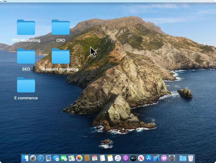 Mac computer desktop screen showing a rocky island wallpaper with five folders labeled PPC Marketing, CRO, SEO, Content marketing, and E commerce, and the dock with various app icons at the bottom.
